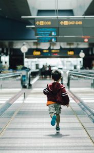 Child running in an airport
